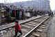 Shenyang, China - March 11 2009: A child plays along a railway at a shanty town where residents will move into low-rent apartments provided by the government, CHINA, december 2009